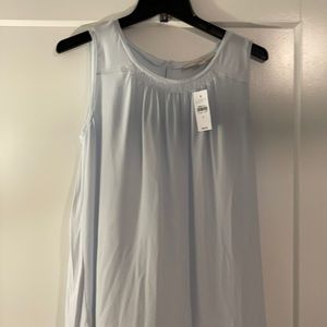 Pale blue sleeveless blouse